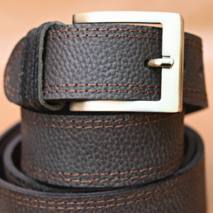 Genuine leather belt for men in 3mm thick buffalo hide, and in 1.5 inches wide strap. Dual stitched in the reddish-brown thread to provide a designer contrast to it. A belt is recommended for long-term use. Available in Pakistan, Canada, and USA.– 1.5 inches wide – 3mm thick – buffalo hide – Delivering from factory – Select your waist from the dropdown and leave the rest. All orders are secured under easy return and refund policy.