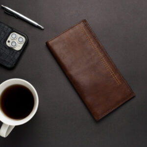 The Bold Long Billfold is a rugged and sturdy accessory that exudes a sense of adventure and individuality. Crafted from high-quality, full-grain leather, this wallet is designed to withstand the rigors of daily use and age gracefully over time, developing a unique patina and character. The leather has a distinct, textured appearance that gives it a raw, natural feel, while the long, spacious design provides ample room for cash, cards, and other essentials. The Bold Long Billfold features multiple compartments and slots, allowing you to organize your belongings with ease. Whether you’re traveling the world or just running errands around town, this Bold Long Billfold is a reliable and stylish choice that will never go out of fashion.