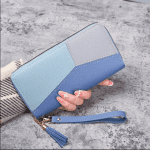 Fashion zipper long wallet for women in PU leather, available in black, blue, and pink.