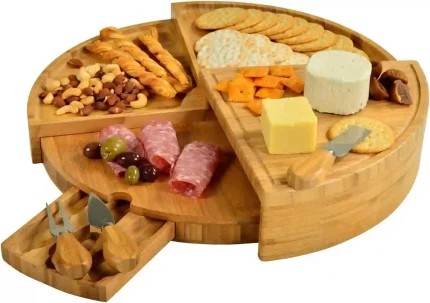 Bamboo cheese and charcuterie board with knife set, compact wedge design expands to 18 inches for entertaining.