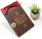 Our Adventure Book Scrapbook with embossed hard cover for DIY photo memories of weddings, travel, and anniversaries.