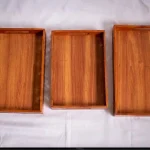 Handmade Pakistani wooden tray with intricate carvings, perfect for serving or decoration.