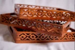 Handmade Pakistani wooden tray with intricate carvings, perfect for serving or decoration.