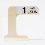 Modern flip calendar desk organizer in black and white colors for stylish home and office decor