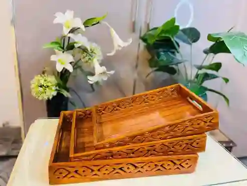 Handmade Pakistani wooden tray with intricate carvings, perfect for serving or decoration.