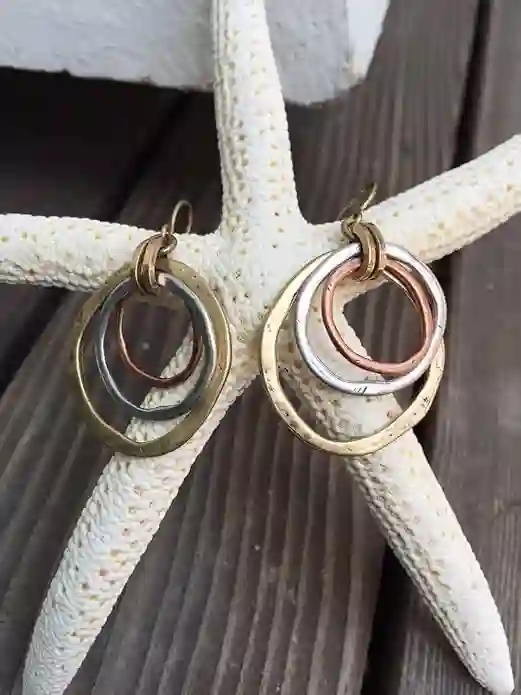 Handmade Sunrise Tricolor Dangle Earrings featuring burnished circles of Copper, Brass, and Silverplated metals.