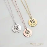 Custom pet portrait necklace with gold-plated stainless steel chain, featuring engraved pet face and name.