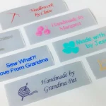 Custom satin sewing labels in 3/4" x 2 1/2" size, perfect for knitting, quilting, and sewing crafts.