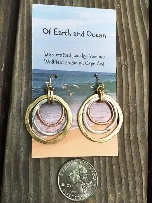 Handmade Sunrise Tricolor Dangle Earrings featuring burnished circles of Copper, Brass, and Silverplated metals.